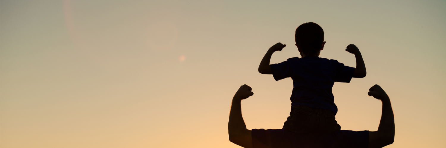 Father and son arm flexing silhouette