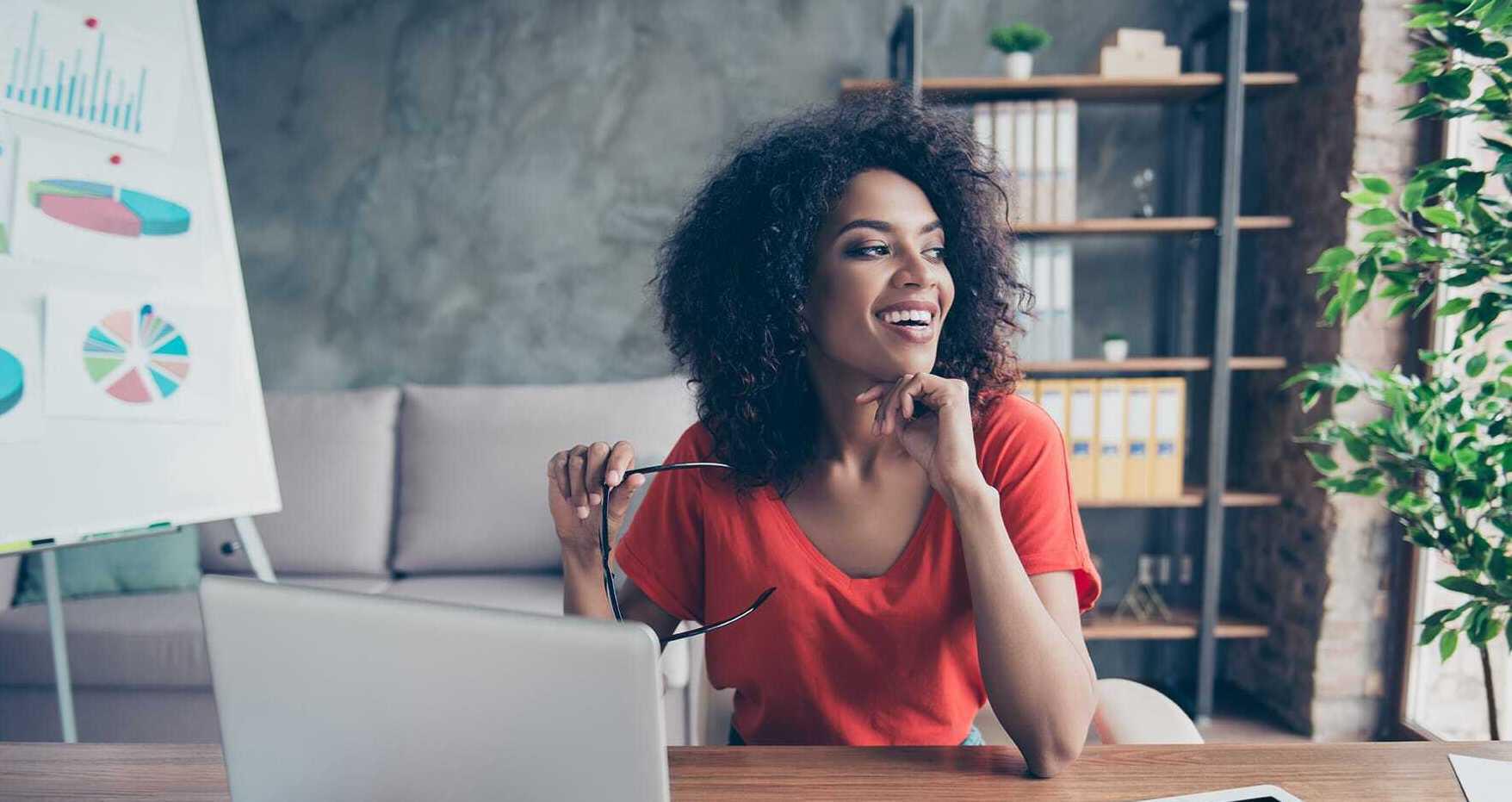 woman smiling in red shirt
